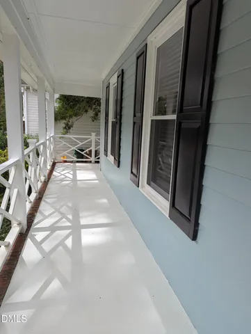 a view of living room with furniture and large window
