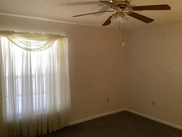 a view of a room with shelves and a closet