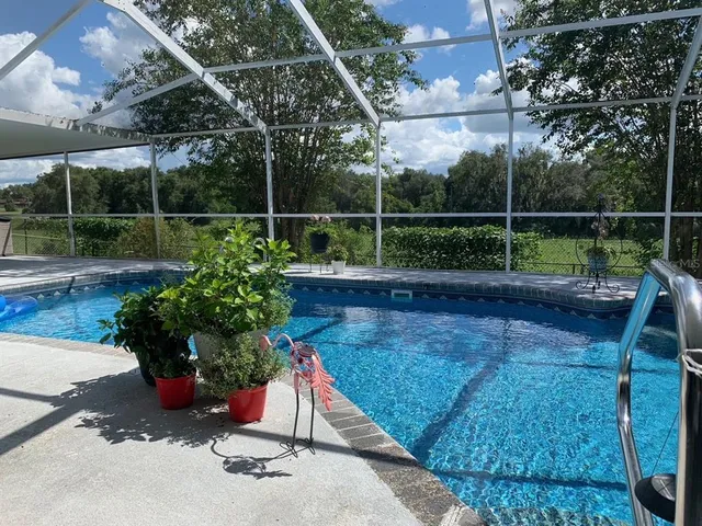 a view of a backyard with chair