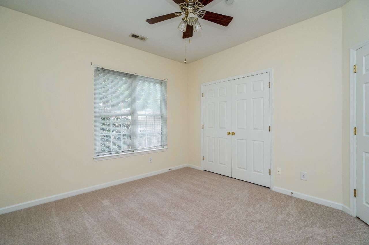 126 Springfork Drive, Unit 1F2 Cary, NC 27513 - Photo 24 of 26 Second Bedroom with Ceiling Fan