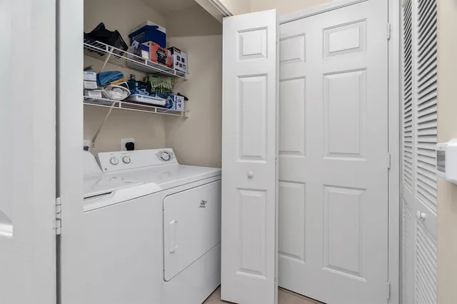 a utility room with dryer and washer