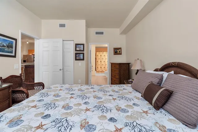 a bedroom with a bed and a dresser