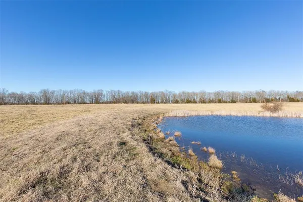 a view of lake with green space