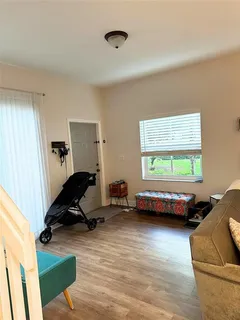 a living room with furniture and a window