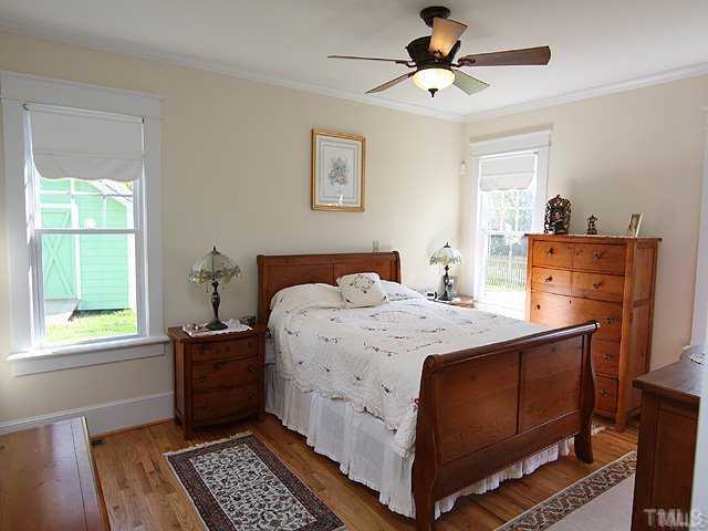 103 Georgetown Road Raleigh, NC 27608 - Photo 6 of 12 a bed room with a bed and a window