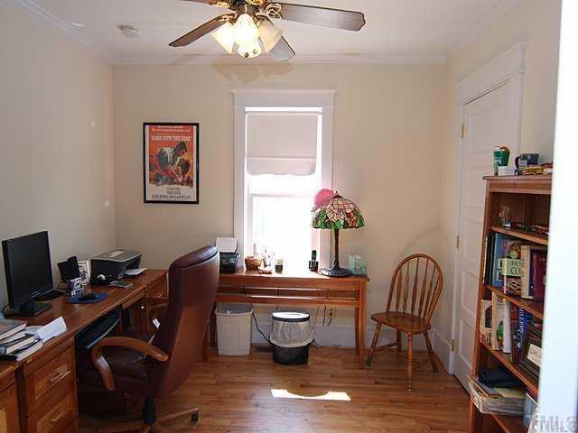 103 Georgetown Road Raleigh, NC 27608 - Photo 9 of 12 a room with furniture and wooden floor