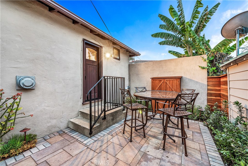 a view of a dinning tables and chair in the balcony