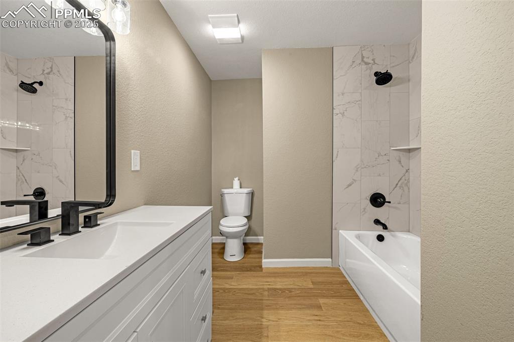 23 Newport Circle Colorado Springs, CO 80906 - Photo 16 of 49 a bathroom with a sink a toilet and shower