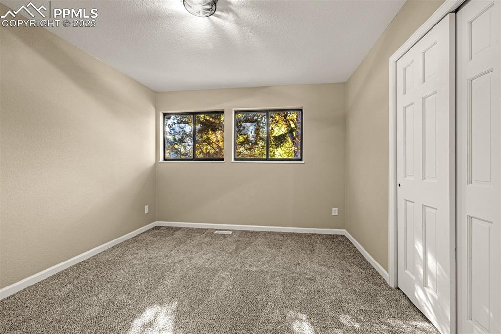 23 Newport Circle Colorado Springs, CO 80906 - Photo 18 of 49 an empty room with windows
