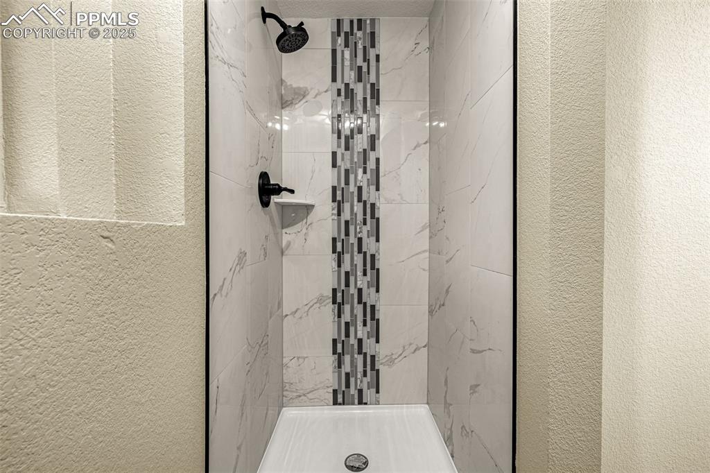 23 Newport Circle Colorado Springs, CO 80906 - Photo 27 of 49 a bathroom with a shower and a sink