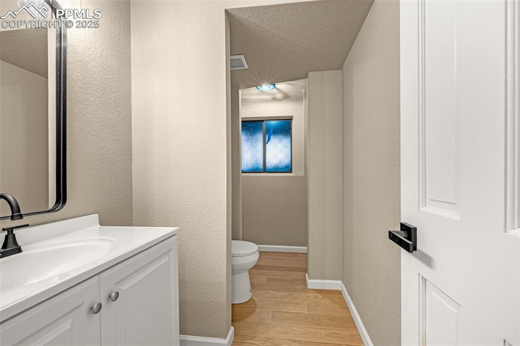 23 Newport Circle Colorado Springs, CO 80906 - Photo 28 of 49 a bathroom with a sink and a mirror