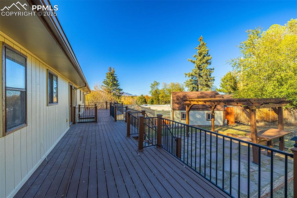 23 Newport Circle Colorado Springs, CO 80906 - Photo 36 of 49 a view of a house with wooden deck