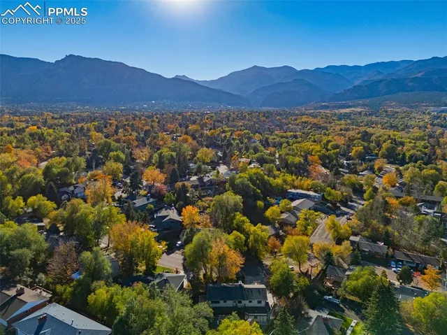 an aerial view of residential house and mountain view