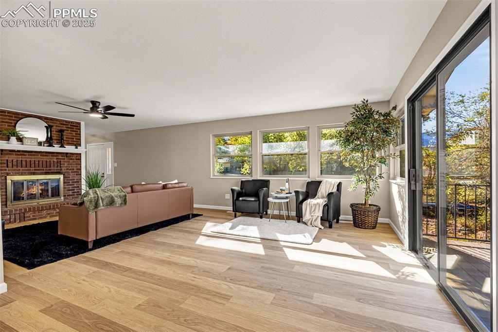 23 Newport Circle Colorado Springs, CO 80906 - Photo 7 of 49 a living room with furniture large window and flat screen tv