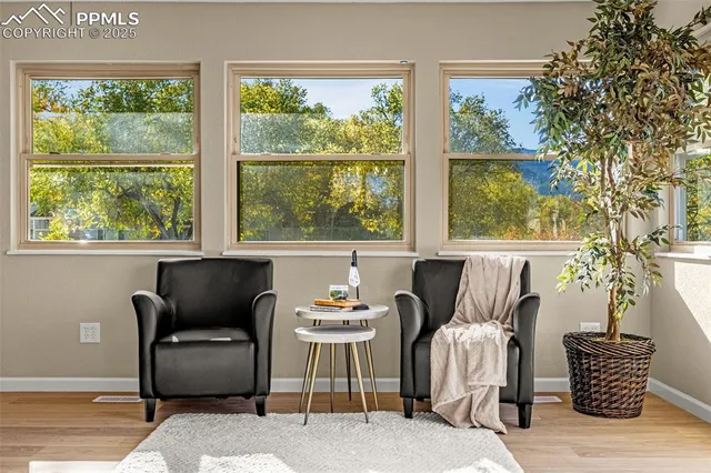 a kitchen with stainless steel appliances a refrigerator and white cabinets