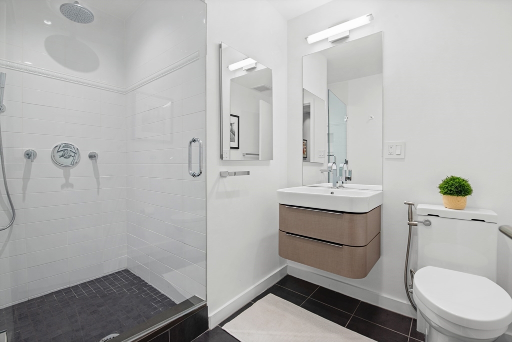 43-45 Winter Street, Unit 4 Boston, MA 02108 - Photo 16 of 24 a bathroom with a sink a toilet and shower