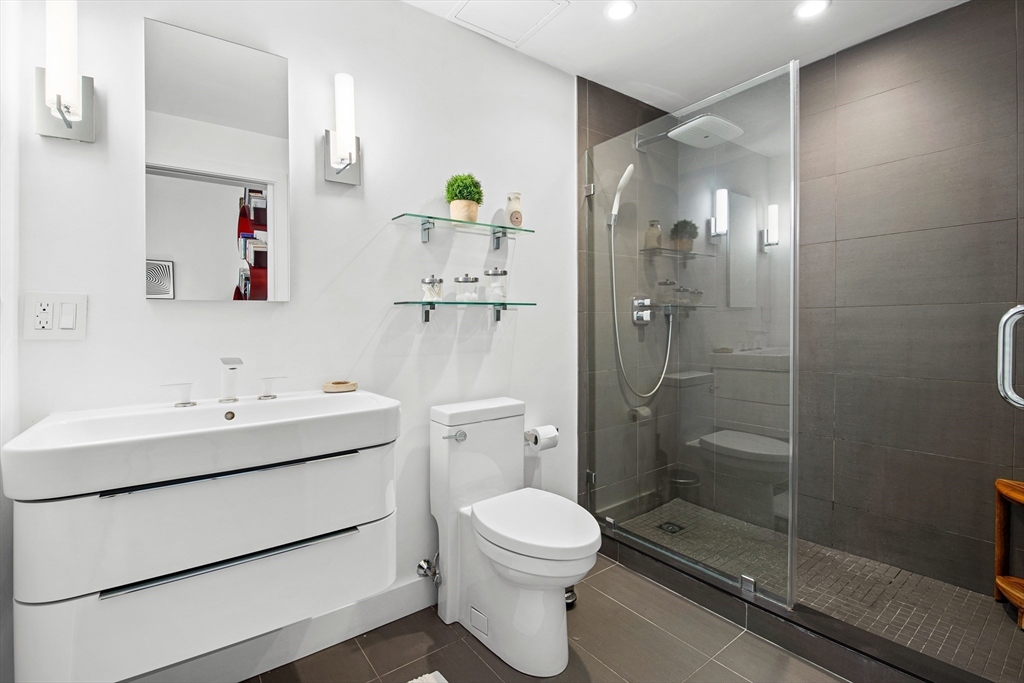 43-45 Winter Street, Unit 4 Boston, MA 02108 - Photo 20 of 24 a bathroom with a sink toilet and shower