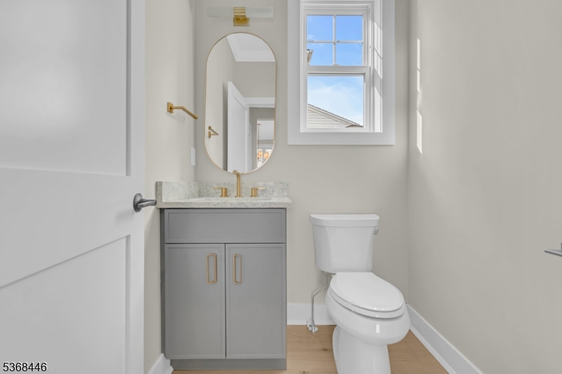 44 Brooklake Road Madison, NJ 07940 - Photo 6 of 44 a bathroom with a sink vanity mirror and toilet