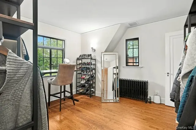 a view of a livingroom with furniture and staircase