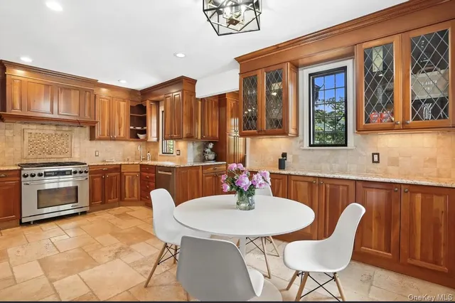a kitchen with a stove a sink and a refrigerator