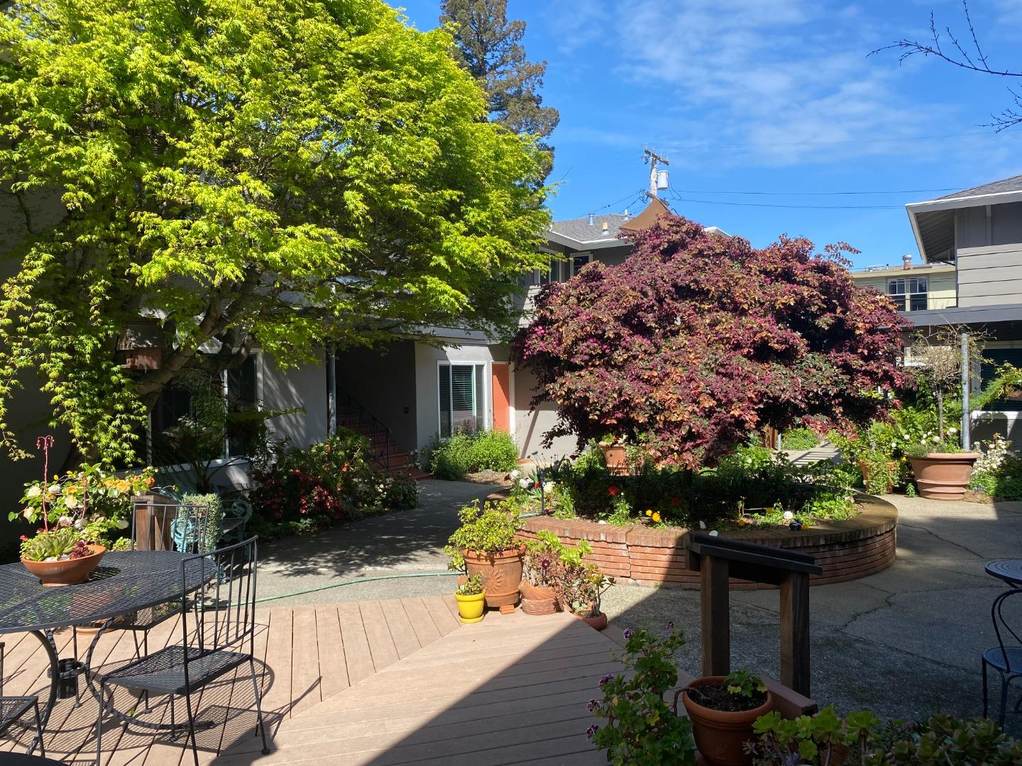 111 Elm Street, Unit 4 San Mateo, CA 94401 - Photo 2 of 9 a front view of a house with a yard