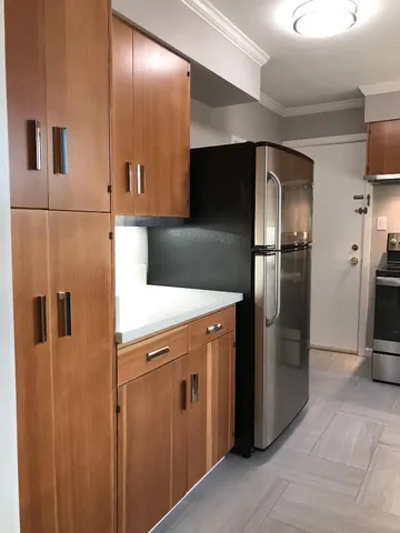 a kitchen with stainless steel appliances a refrigerator and a sink