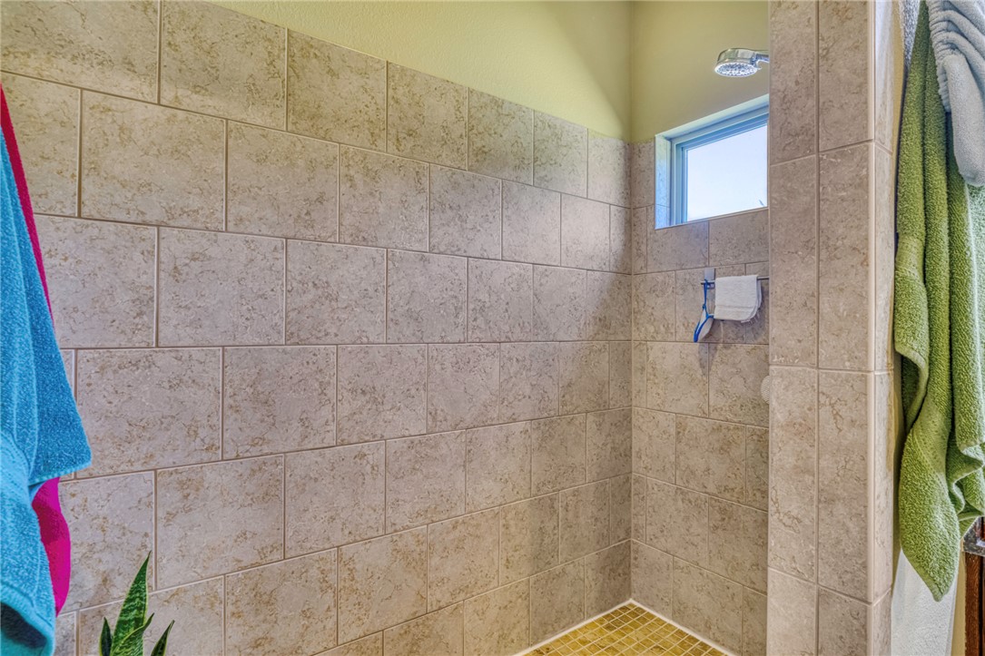 9945 Oxford Cemetery Road Madisonville, TX 77864 - Photo 21 of 42 Full bathroom with a tile shower