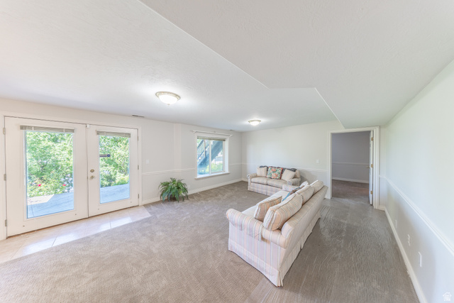 144 Bountiful Boulevard Bountiful, UT 84010 - Photo 25 of 28 Living room featuring french doors and light carpet