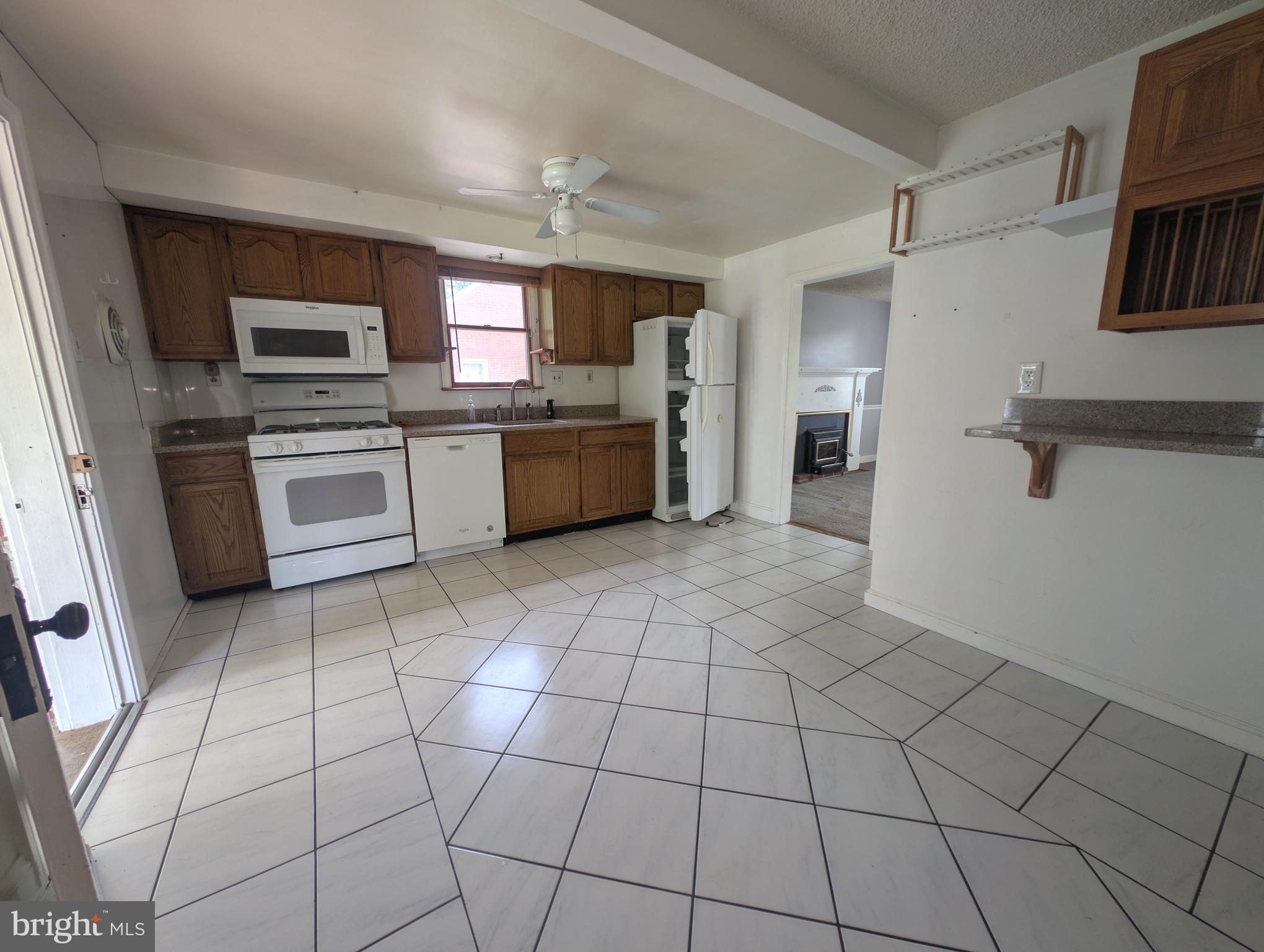 1129 Providence Road Springfield, PA 19064 - Photo 4 of 15 a large kitchen with cabinets and stainless steel appliances