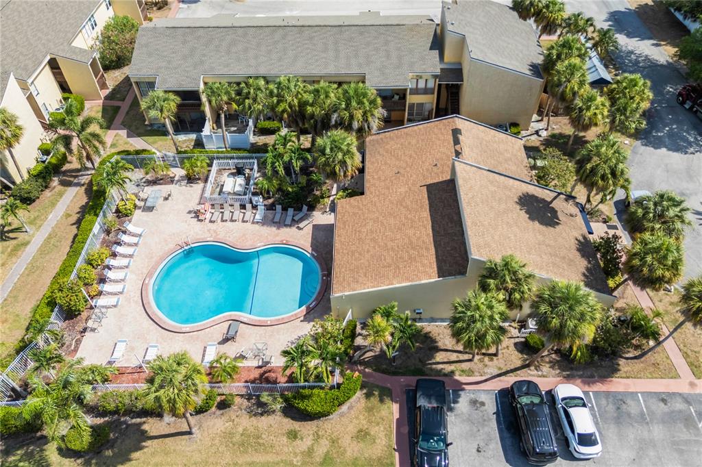 3405 Clark Road, Unit 205 Sarasota, FL 34231 - Photo 20 of 28 an aerial view of a house with a yard and a garden