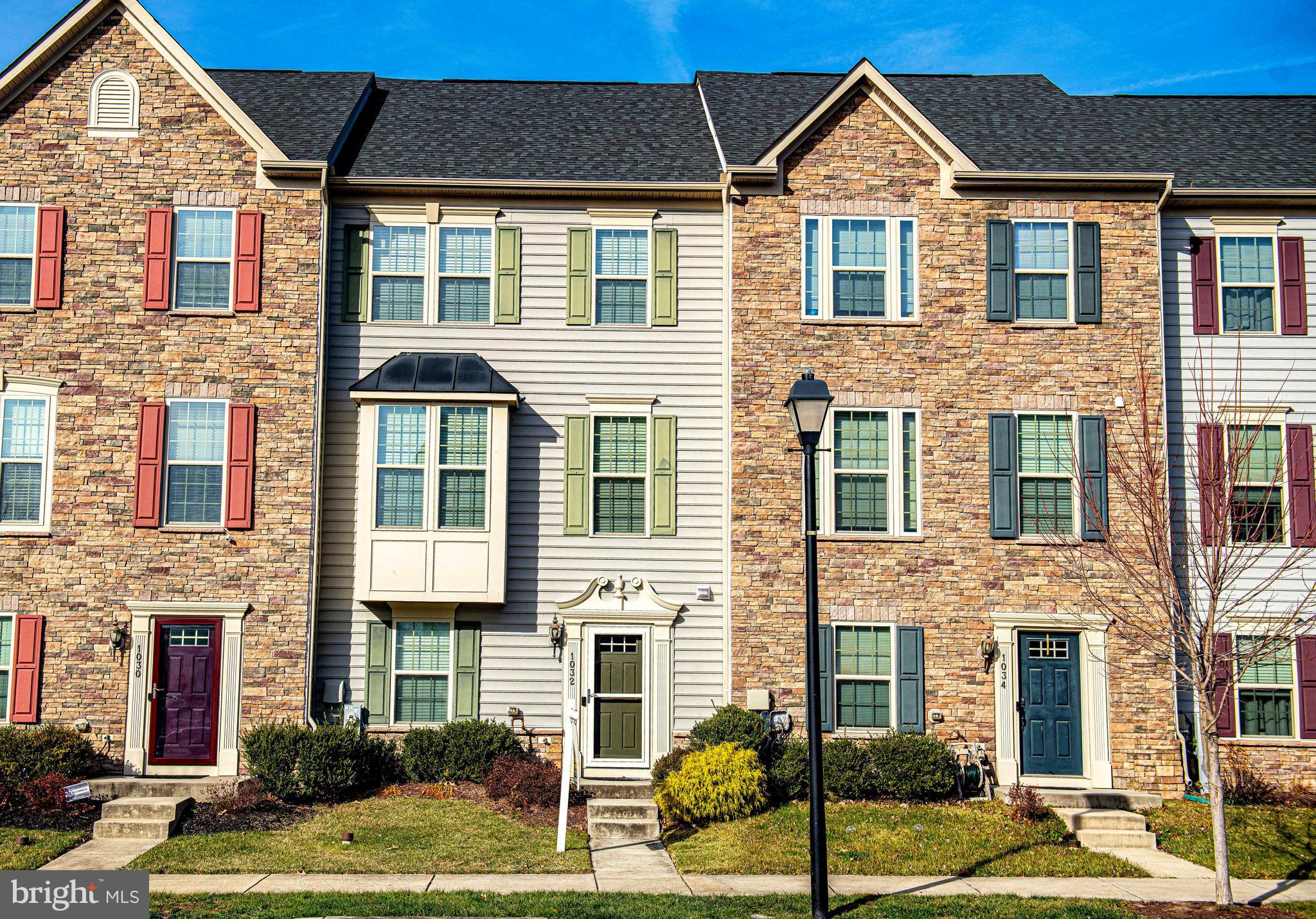 1032 Ramble Run Road Baltimore, MD 21220 - Photo 1 of 46 a front view of a house with a yard