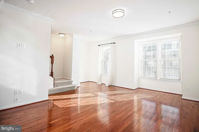 a view of an entryway with wooden floor
