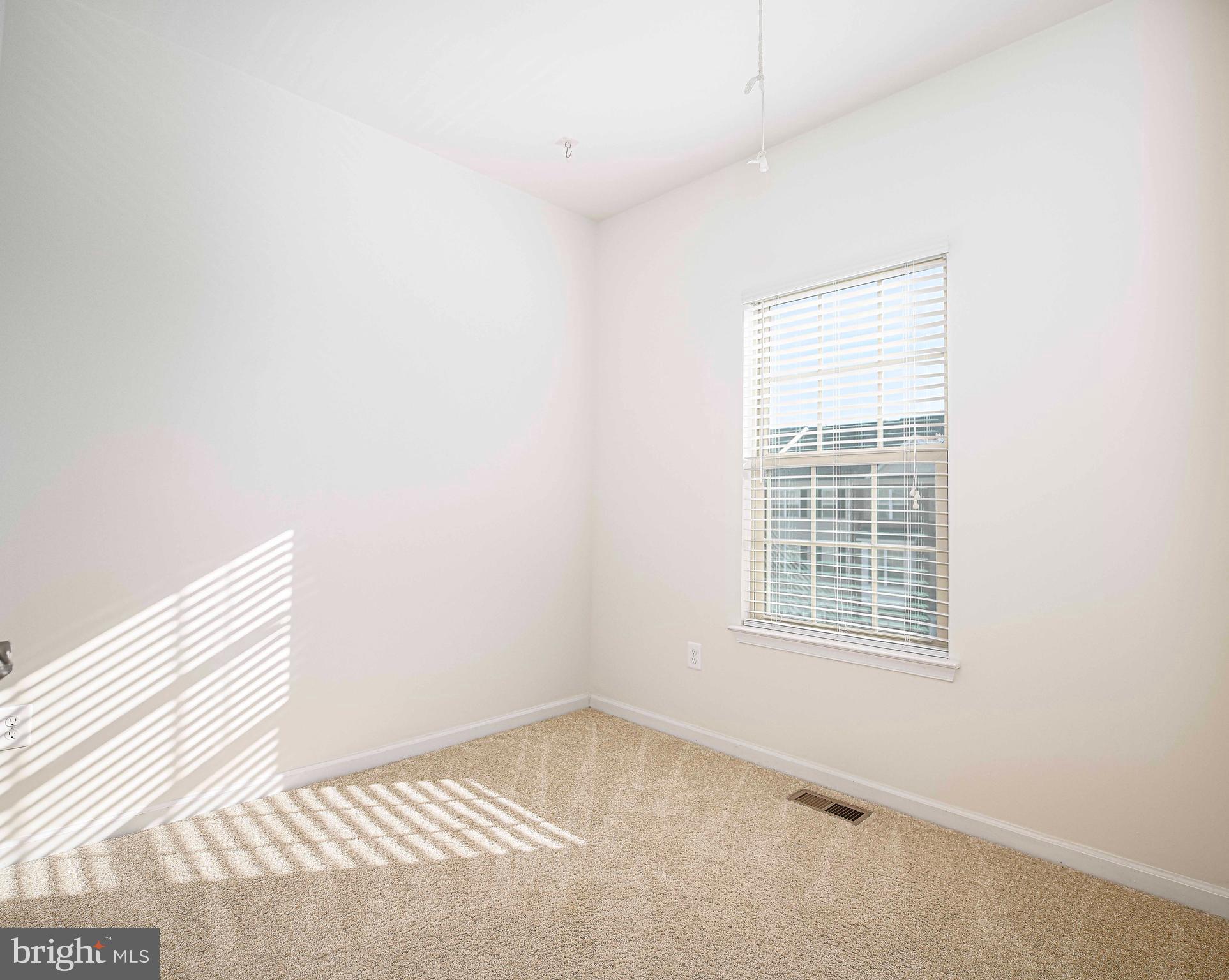 1032 Ramble Run Road Baltimore, MD 21220 - Photo 23 of 46 an empty room with a window