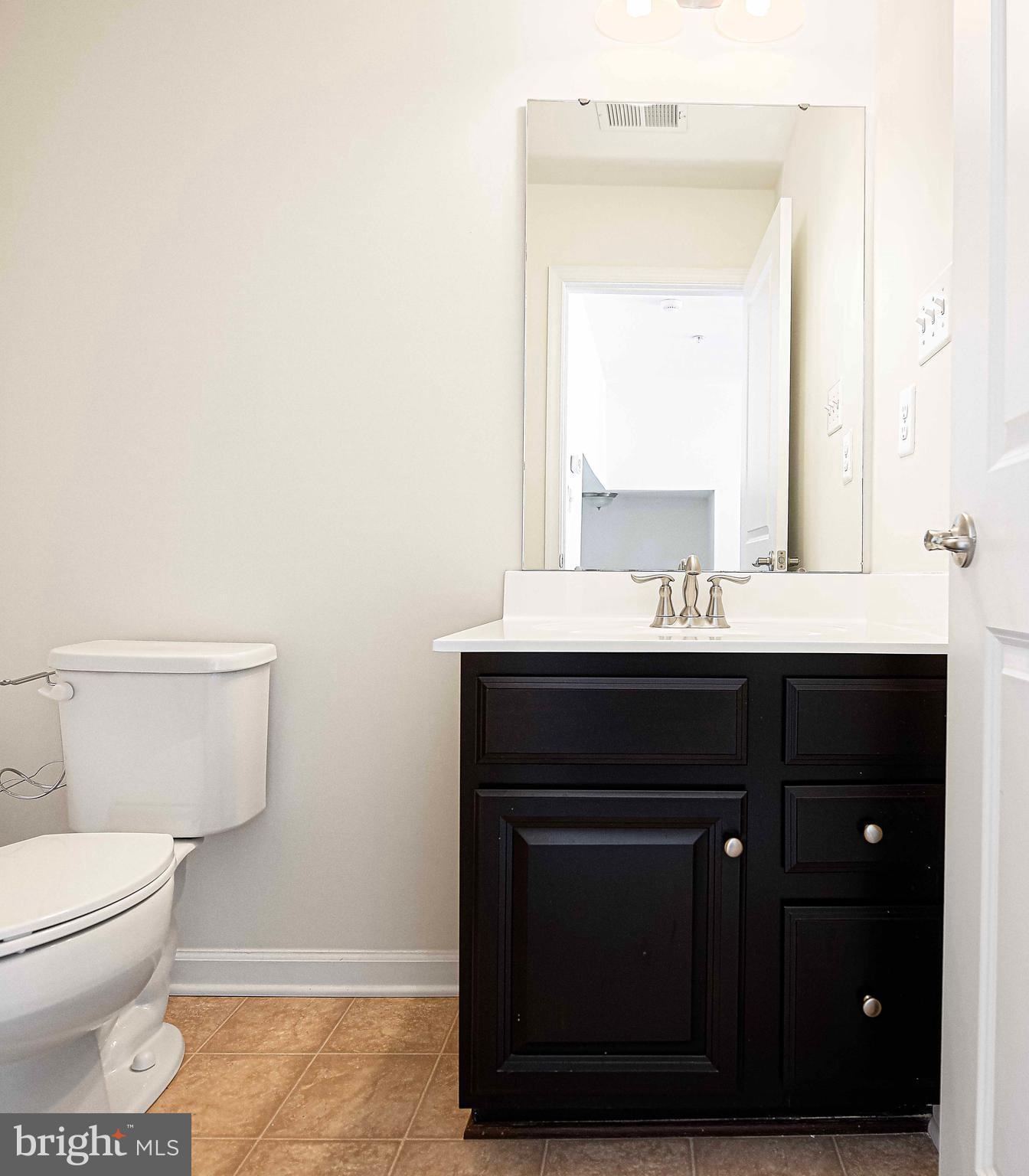 1032 Ramble Run Road Baltimore, MD 21220 - Photo 29 of 46 a bathroom with a sink and a toilet