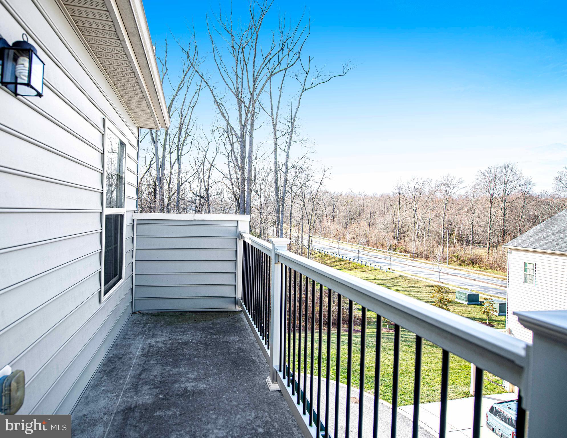 1032 Ramble Run Road Baltimore, MD 21220 - Photo 31 of 46 a view of a balcony with an outdoor space