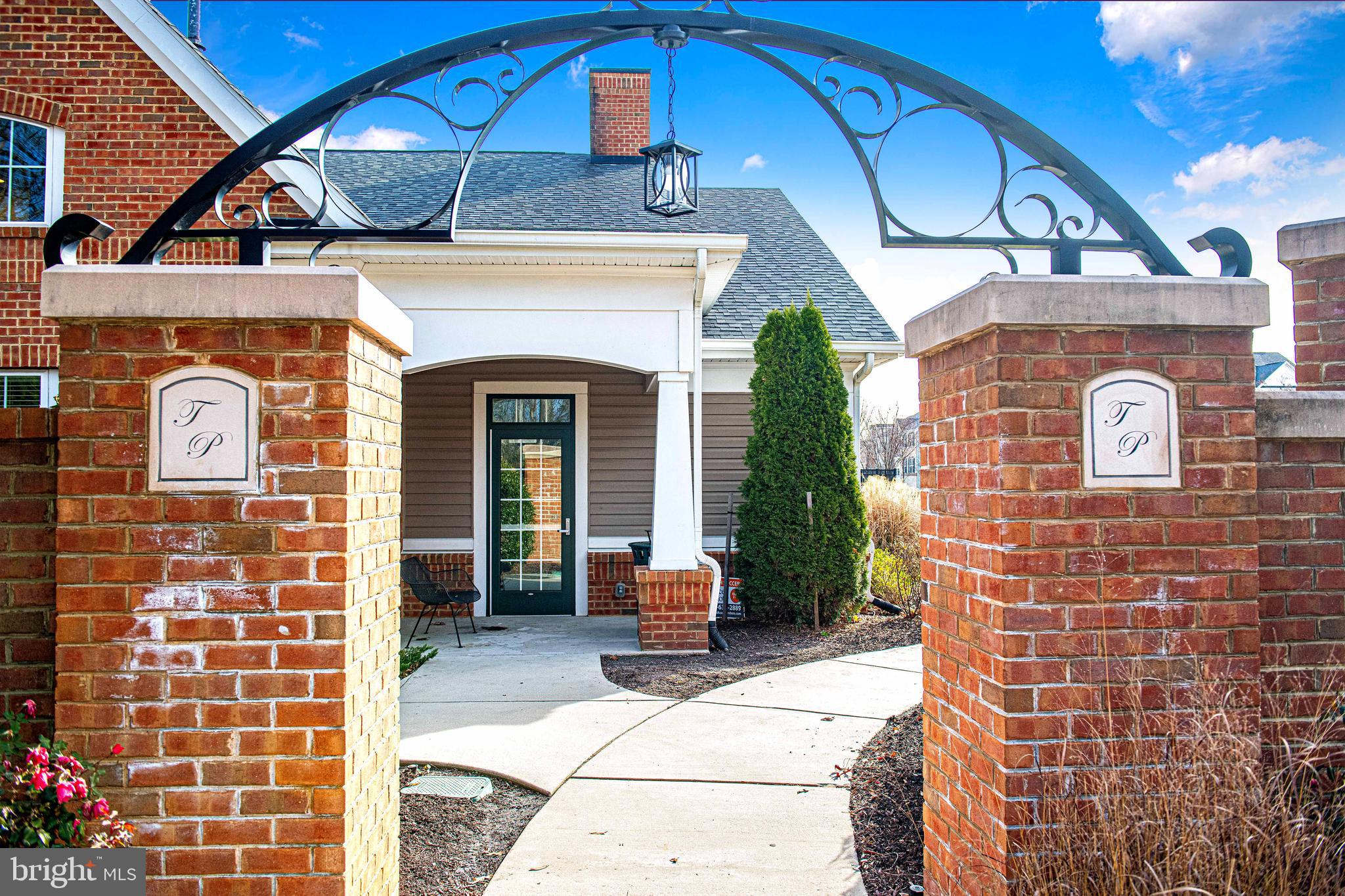 1032 Ramble Run Road Baltimore, MD 21220 - Photo 38 of 46 a front view of a house with a garden