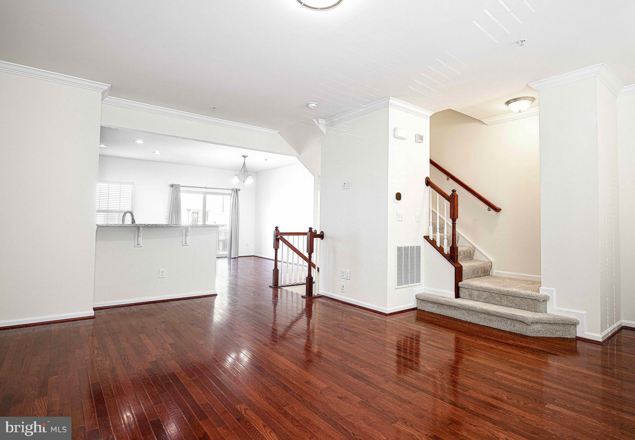 1032 Ramble Run Road Baltimore, MD 21220 - Photo 9 of 46 a view of entryway and hall with wooden floor