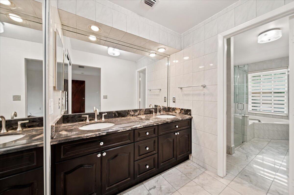 20009 Northwest 66th Place Hialeah, FL 33015 - Photo 18 of 33 a bathroom with a granite countertop sink mirror and double