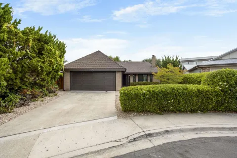 front view of a house with a garden
