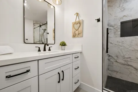 a bathroom with a sink and mirror