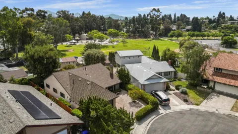 an aerial view of a house with a garden