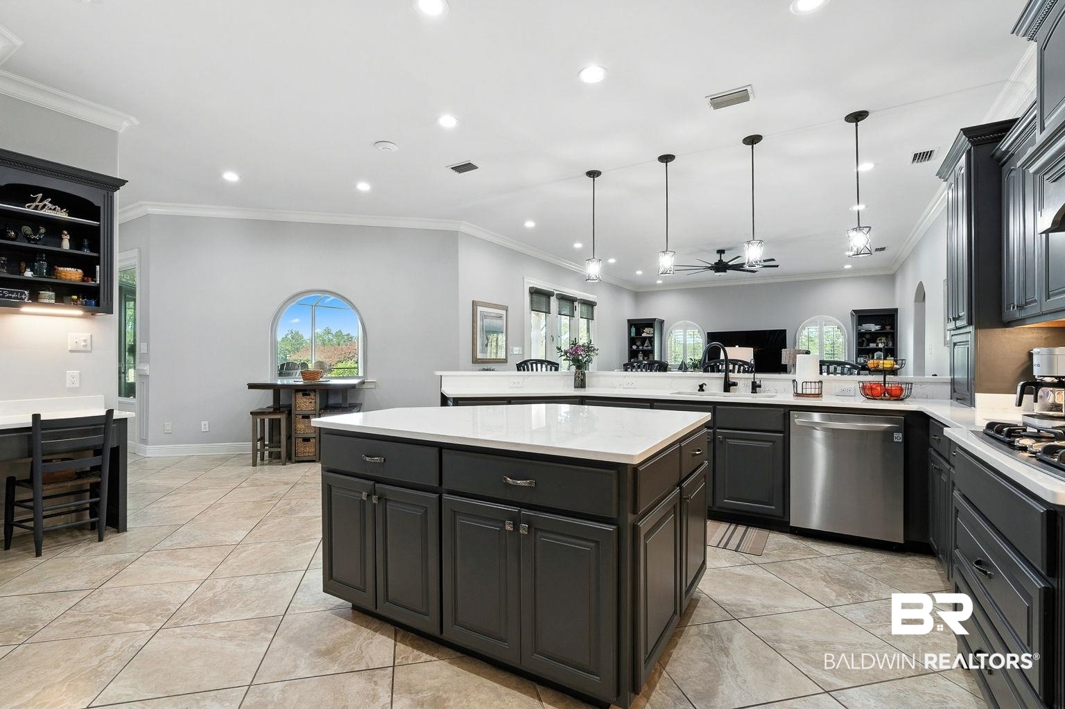23357 Carnoustie Drive Foley, AL 36535 - Photo 39 of 99 Kitchen featuring crown molding, recessed lighting, light countertops, stainless steel appliances, and a kitchen island