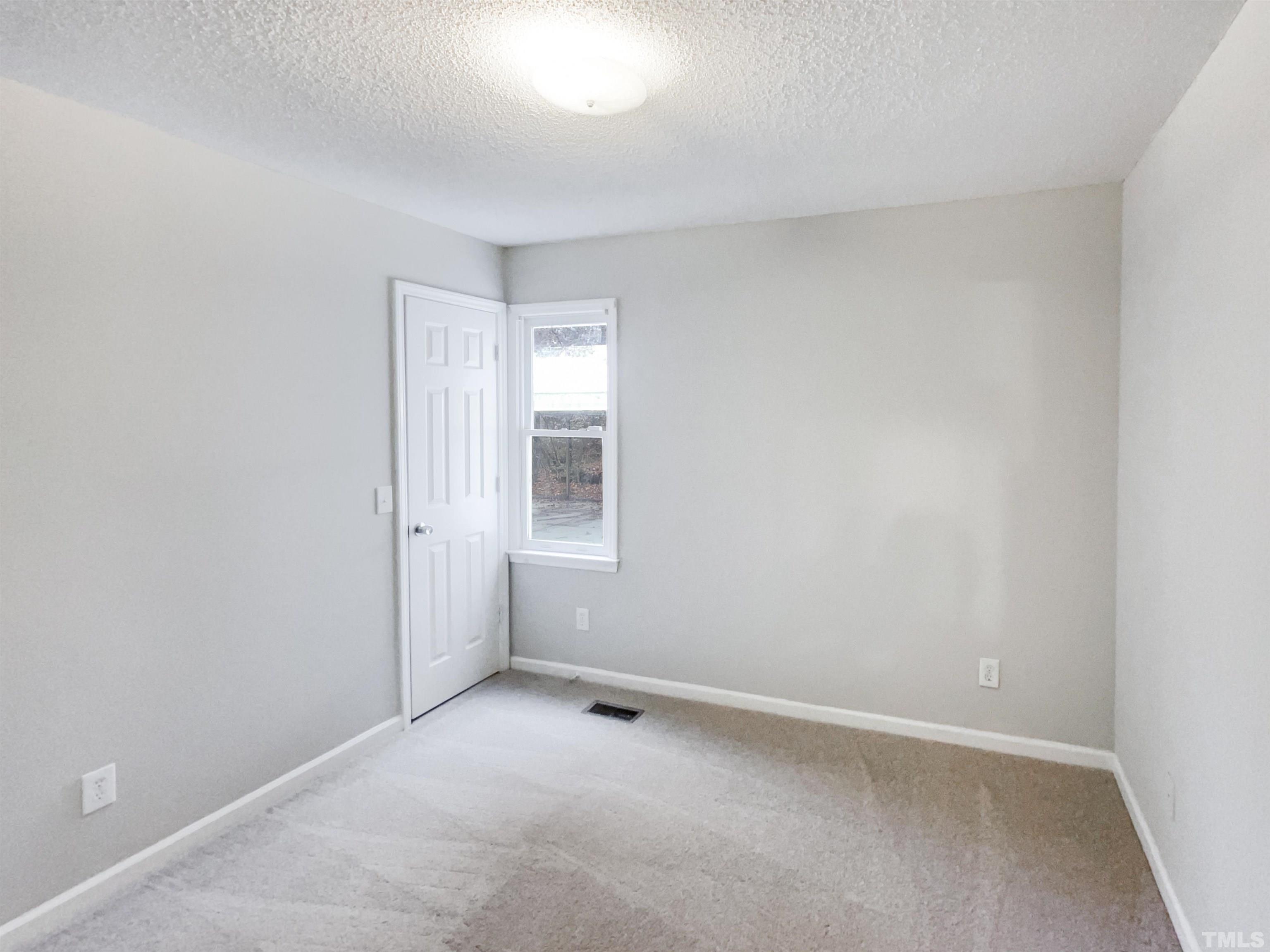 1459 Atkins Road Fuquay-Varina, NC 27526 - Photo 13 of 21 an empty room with windows