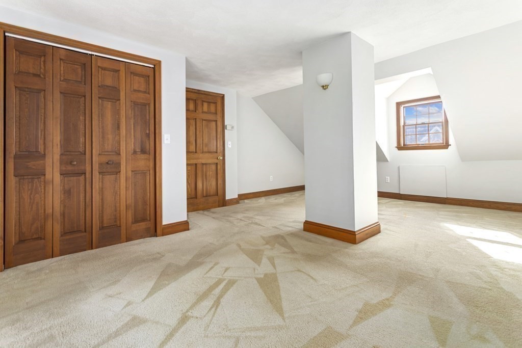 82 Spring Street Stoneham, MA 02180 - Photo 20 of 34 a view of a livingroom with an empty space and a window