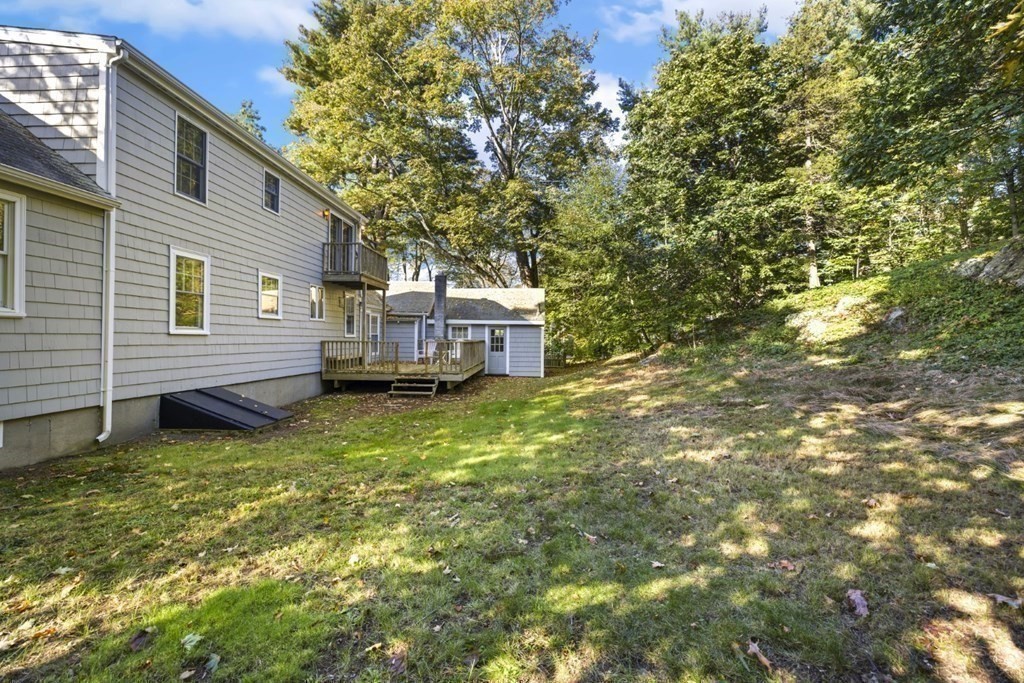 82 Spring Street Stoneham, MA 02180 - Photo 26 of 34 a view of a house with a yard