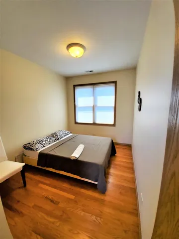 a room with a bed and a window