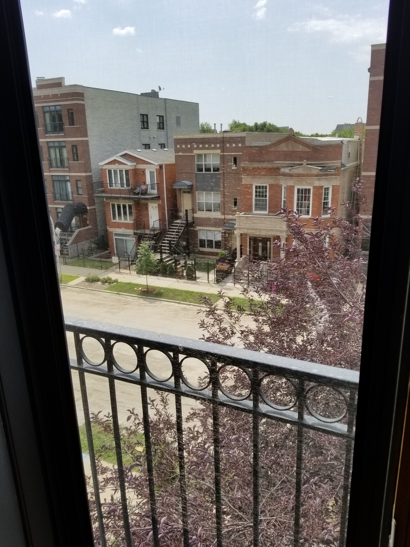 2226 West Monroe Street, Unit 3 Chicago, IL 60612 - Photo 7 of 17 a view of a city from a balcony