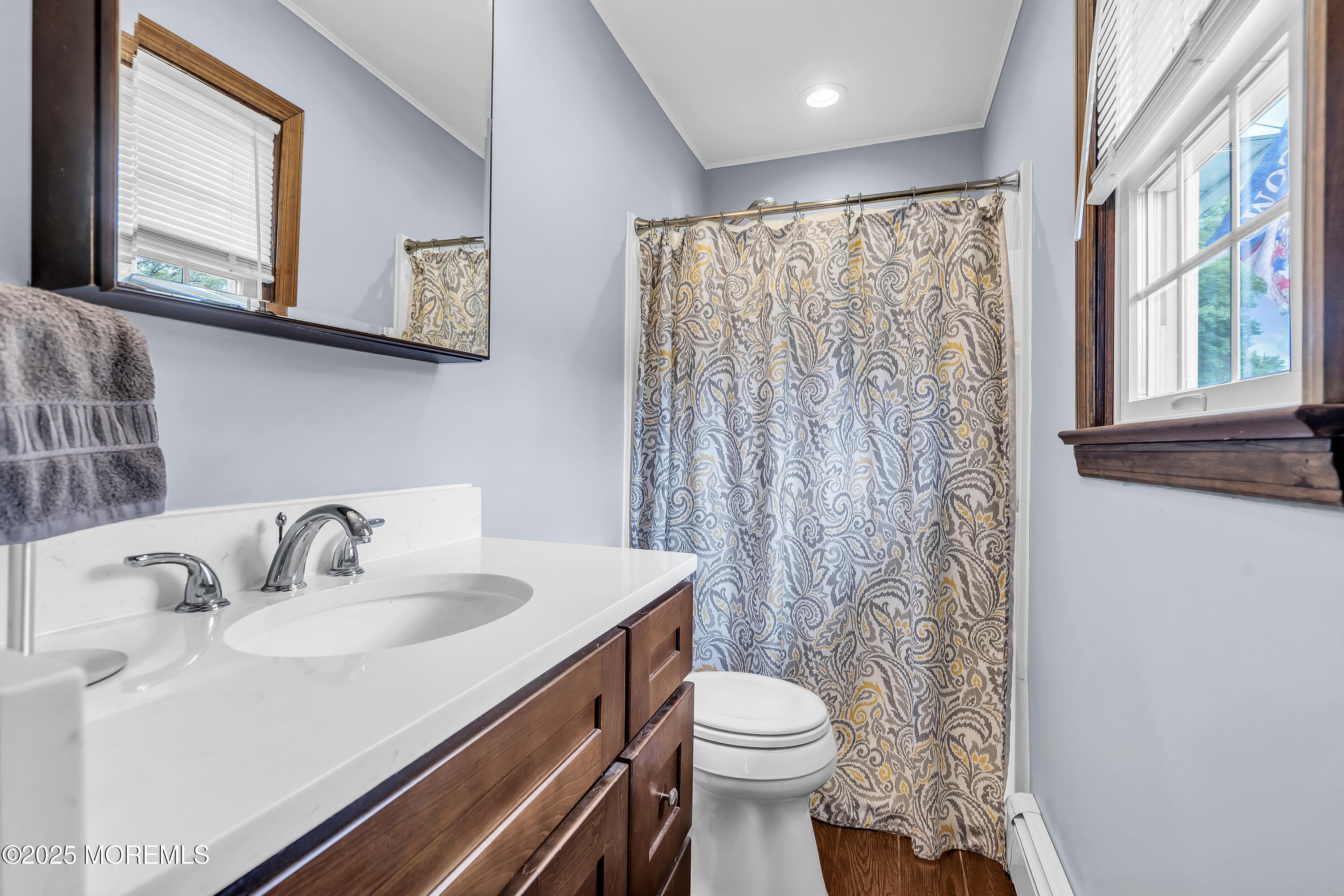 1759 Burrsville Road Brick, NJ 08724 - Photo 12 of 18 a bathroom with a sink toilet a mirror and shower curtain