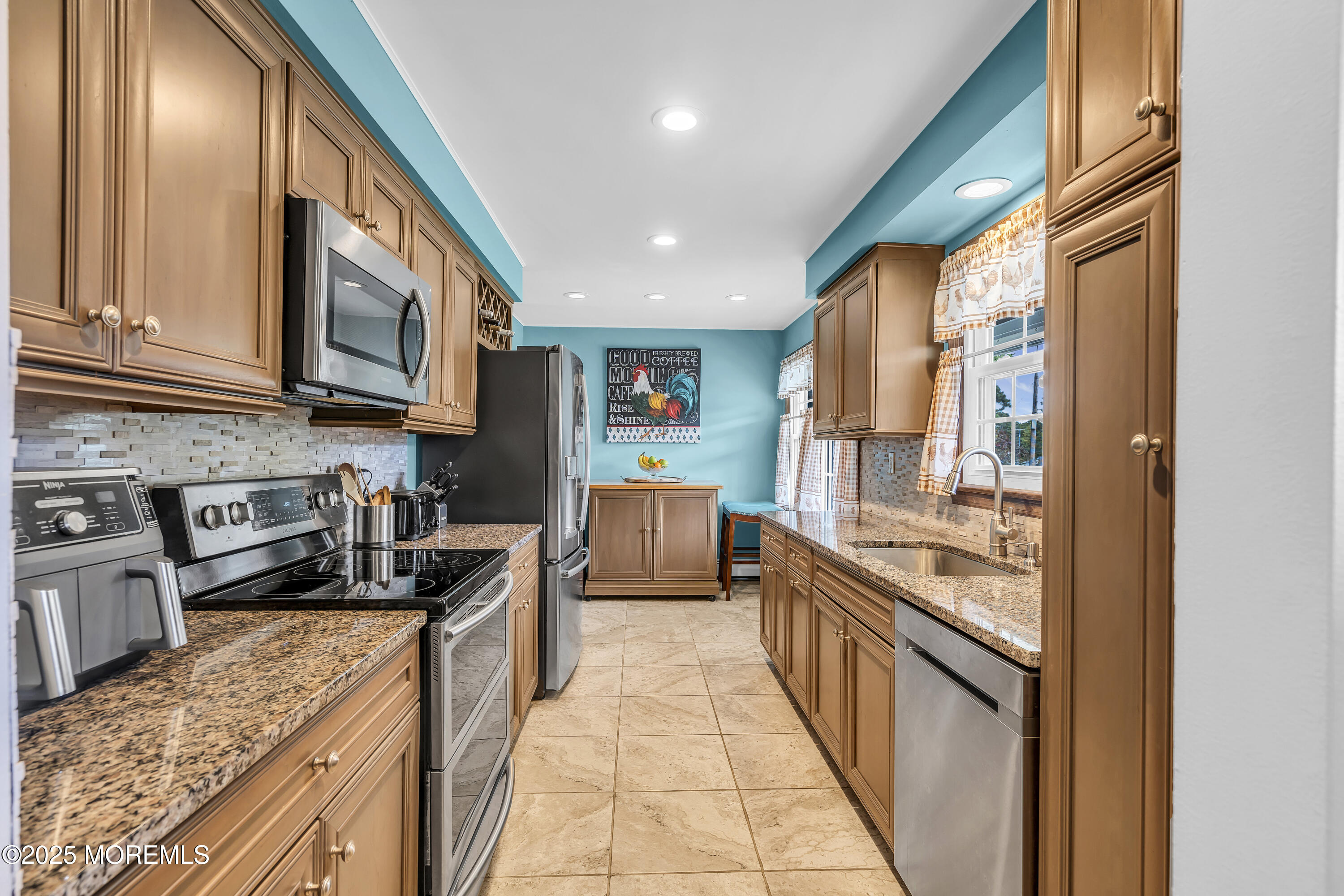 1759 Burrsville Road Brick, NJ 08724 - Photo 2 of 18 a kitchen with stainless steel appliances granite countertop a stove a sink and a refrigerator