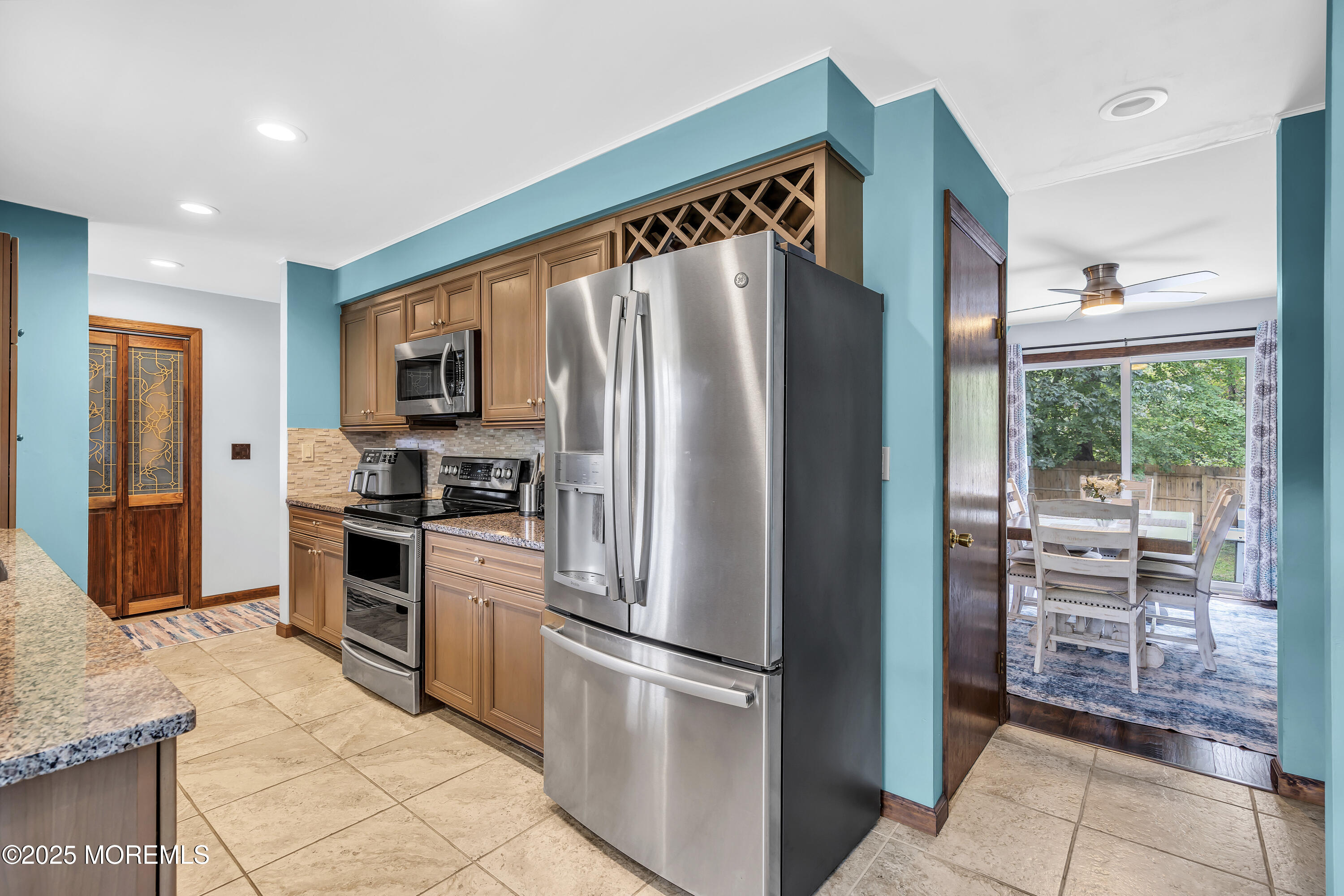 1759 Burrsville Road Brick, NJ 08724 - Photo 3 of 18 a kitchen with stainless steel appliances granite countertop a refrigerator and a stove top oven